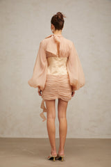 A short floral dress with cinched waist and floral appliques on a paneled design