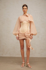 A short floral mini dress with cinched waist and applique details featuring paneled construction in light colors