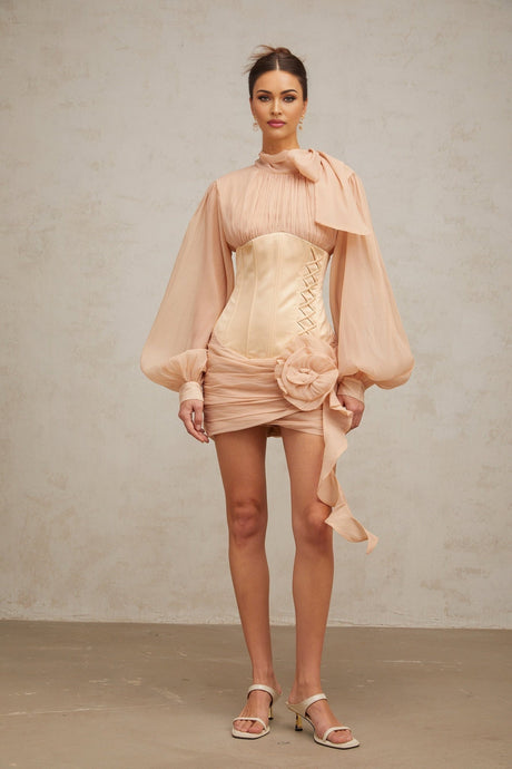 A short floral mini dress with cinched waist and applique details featuring paneled construction in light colors