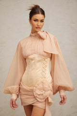 A short floral mini dress with cinched waist and paneled design featuring floral applique details