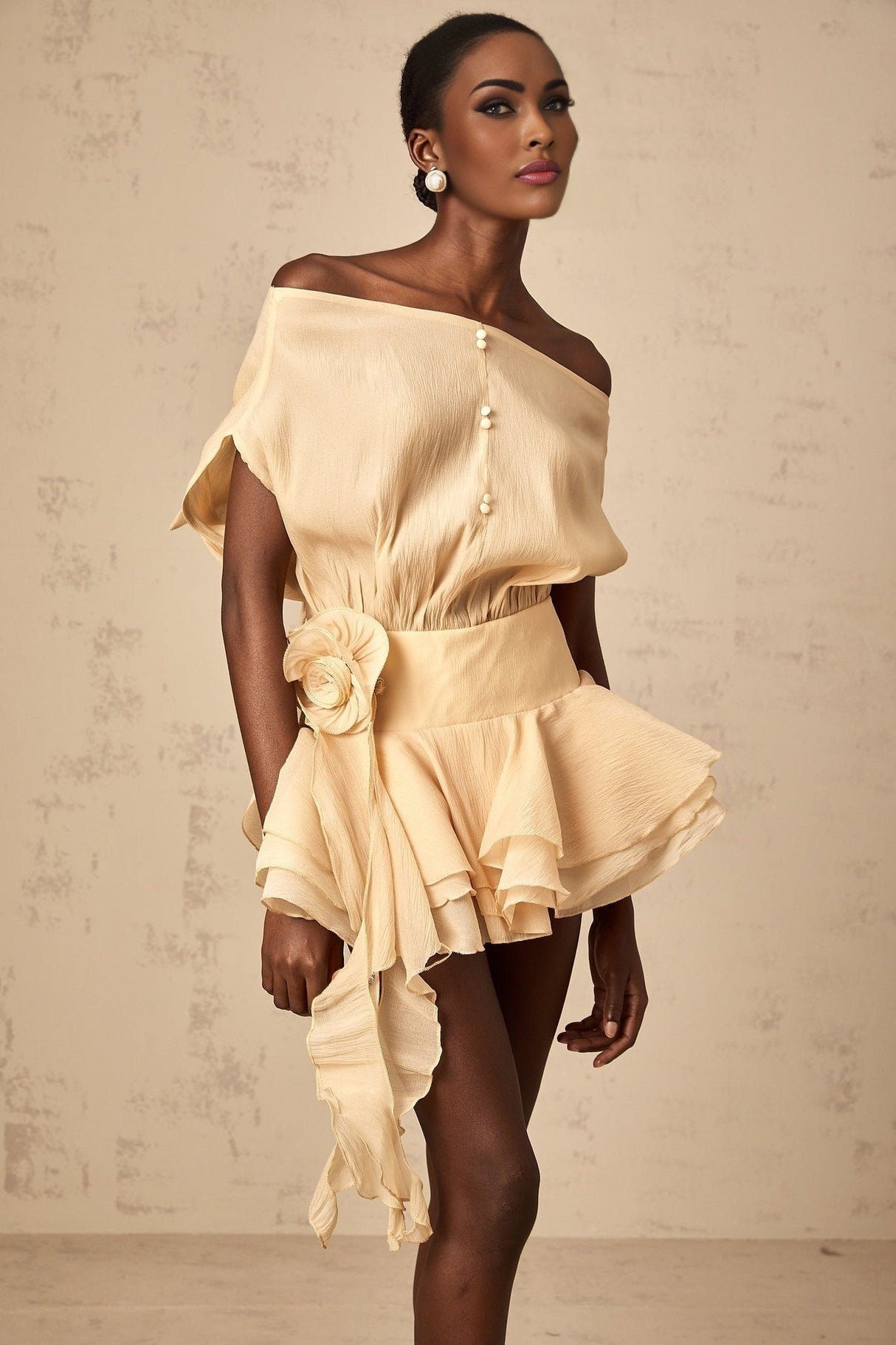 A short floral mini dress with ruffled layers and floral applique details named Amelie