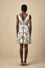 A short floral print dress with a vneck neckline and a mini length in a vibrant pattern