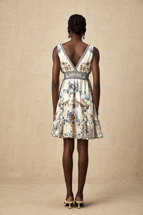 A short floral print dress with a vneck neckline and a mini length in a vibrant pattern