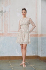 A short floral print dress with pleats and a mini length featuring a Marion design