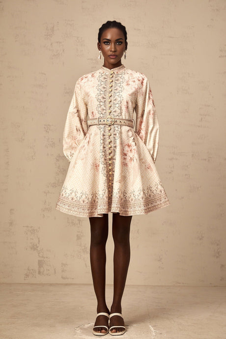 A short floral print mini dress with a belt around the waist featuring a vibrant pattern and a fitted silhouette