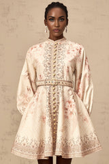 A short floral print mini dress with a belt at the waist featuring a colorful pattern on a light background