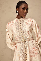 A short floral print mini dress with a belt cinching the waist featuring a colorful pattern on a light background