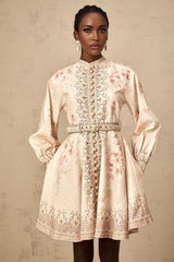 A short floral print mini dress with a belt featuring a colorful pattern on a light background and a fitted silhouette