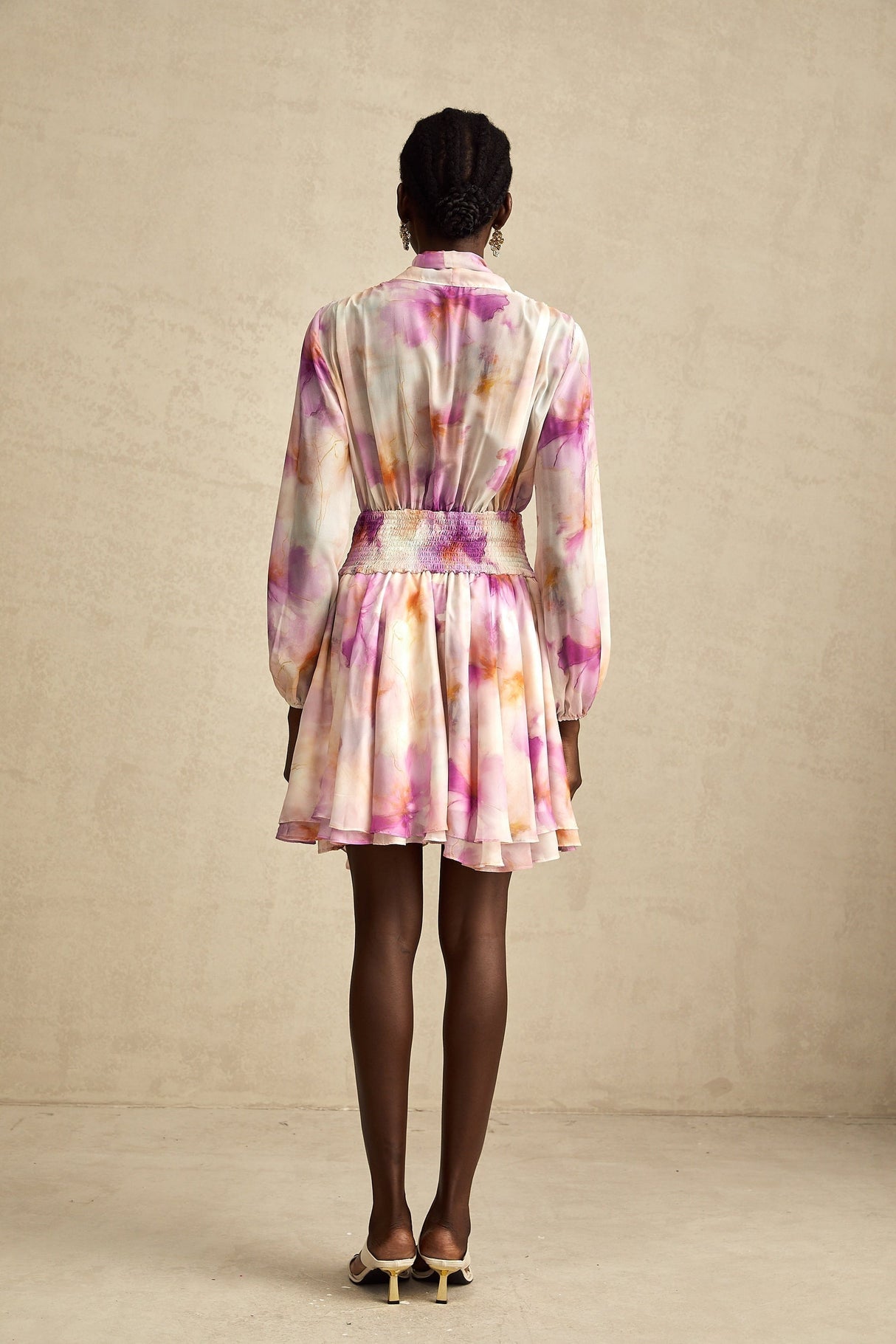 A short floral print mini dress with a V neckline in the Maelys style
