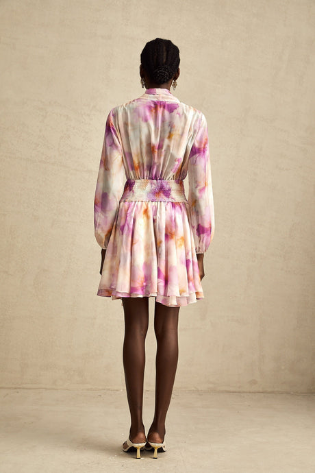 A short floral print mini dress with a V neckline in the Maelys style