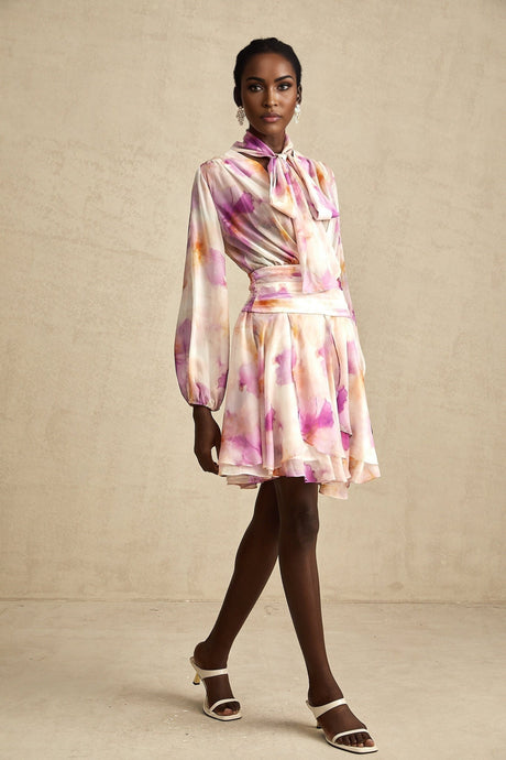 A short floral print mini dress with a V neckline in the Maelys style