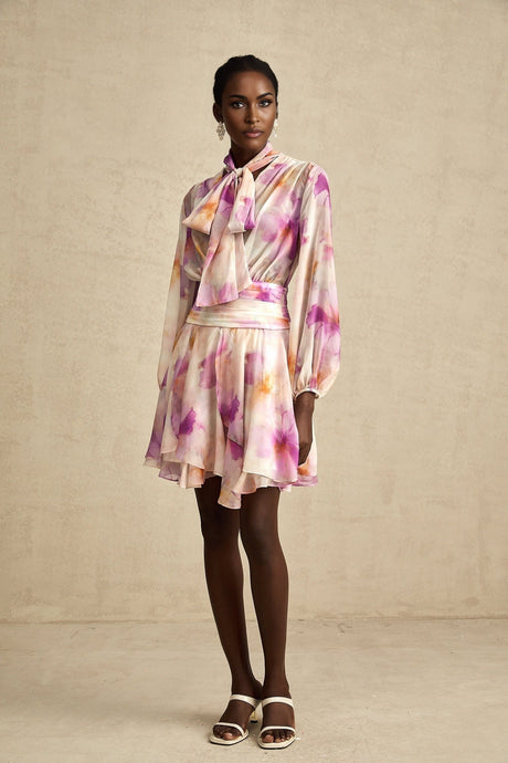A short floral print mini dress with a V neckline in the Maelys style
