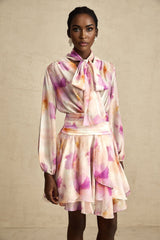 A short floral print mini dress with a V neckline in the Maelys style