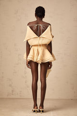 A short flounced mini dress with floral appliques featuring a light and feminine design