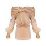 A short gold mini dress with crystal embellishments and paneled design featuring a sleeveless silhouette and shimmering fabric