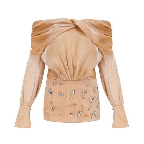 A short gold mini dress with crystal embellishments and panelled design featuring Adelina style