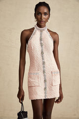 A short halterneck mini dress in shimmering fabric with crystal embellishments