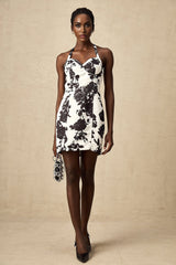 A short halterneck mini dress with a floral print pattern called Gabrielle
