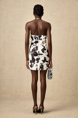 A short halterneck mini dress with a floral print pattern featuring a design called Gabrielle