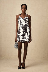 A short halterneck mini dress with a floral print pattern named Gabrielle
