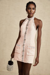 A short halterneck mini dress with crystal embellishments featuring a Louise design