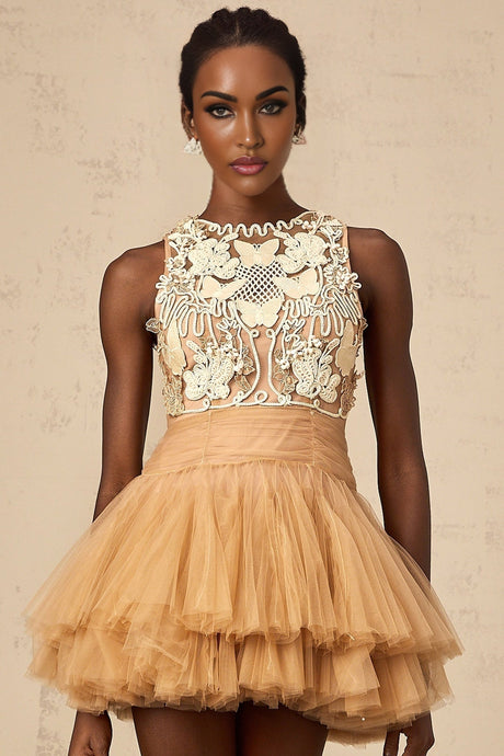 A short khaki dress with corded lace panels and embellishments on a tulle fabric featuring a mini length design