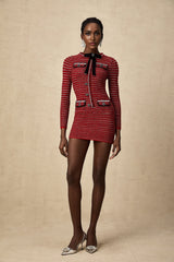 A short knit mini dress with a bow detail named Faustine