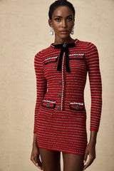A short knit mini dress with a bow detail named Faustine