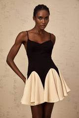 A short mini dress with colorblocked design featuring godet pleats named Justine