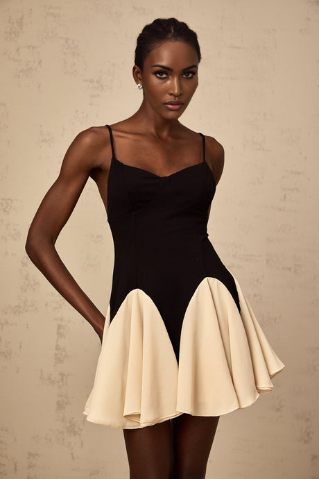 A short mini dress with colorblocked design featuring godet pleats named Justine