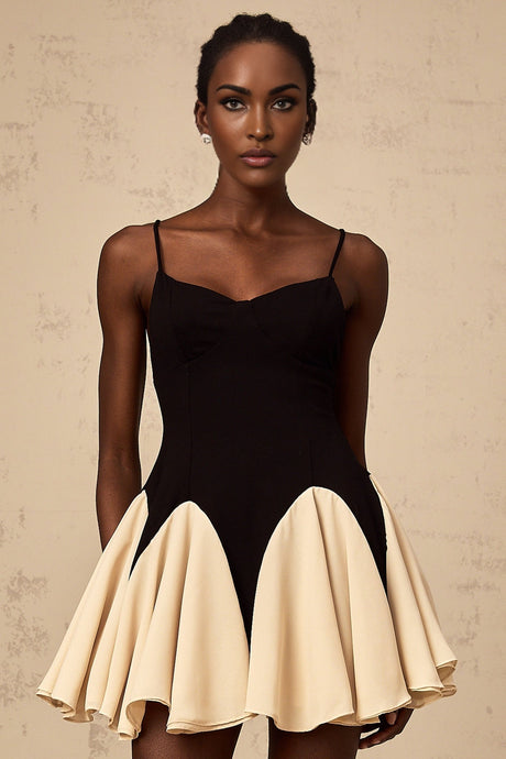 A short mini dress with godet pleated skirt featuring color blocking design named Justine