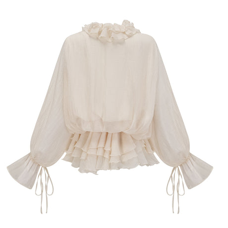 A short neutral colored mini dress with tiered layers and floral applique details named Zephyrine