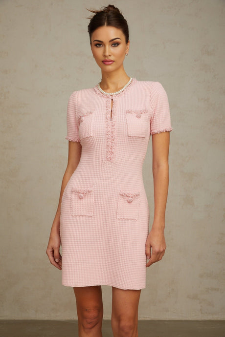 A short pink knitted mini dress with beaded embellishments called Eugenie