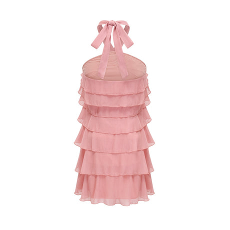 A short pink mini dress with a halter neckline and tiered skirt design