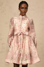 A short pink mini dress with floral print pattern and embellished details