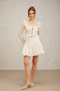 A short pleated mini skirt with shimmering sequins covering the fabric creating a sparkly and festive appearance