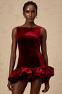 A short red velvet dress with a peplum hem detail and mini length perfect for evening wear