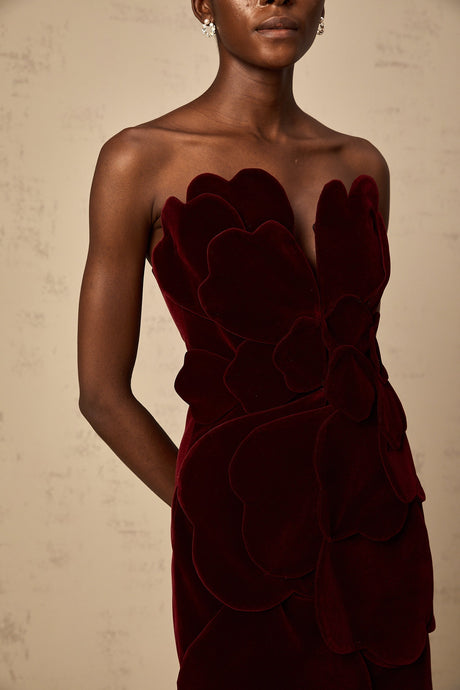 A short red velvet dress with floral appliques featuring a mini length design by Maiwenn