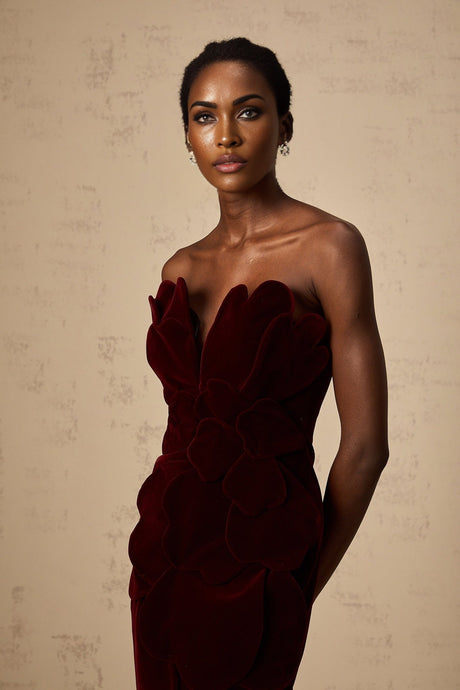 A short red velvet mini dress with floral appliques featuring a fitted silhouette and feminine design
