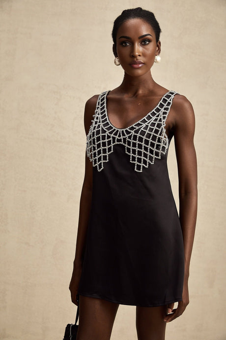 A short sleek satin mini dress adorned with sparkling crystal embellishments named Leonore