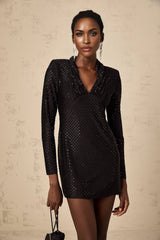 A short sleeveless mini dress with a deep plunging V neckline adorned with studs and embellishments featuring a fitted silhouette and likely in a dark color
