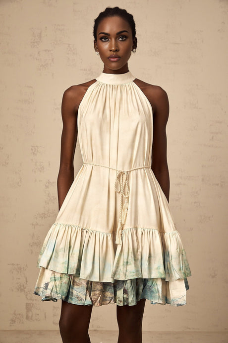 A short sleeveless mini dress with a layered design featuring a colorful pattern print named Delphine