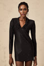 A short sleeveless mini dress with a plunging V neckline adorned with studs and embellishments featuring a fitted silhouette and a Mariasole design
