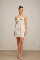 A short sparkly dress with sequin embellishments called the Esther mini dress