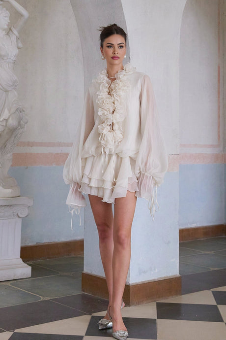 A short tiered neutral mini dress with floral applique details called Zephyrine