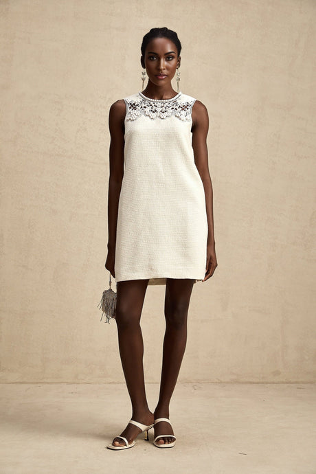 A short tweed mini dress with embroidery details and cut out sections featuring a fitted silhouette in a classic Beatrice style