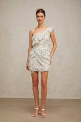 A short white dress with a pattern print and ruffled details featuring a mini length design
