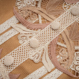 A short white lace dress with a peplum waist and cut out details featuring a fitted bodice and flared skirt