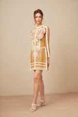 A short white lace dress with a peplum waist and cut out details featuring a fitted bodice and flared skirt