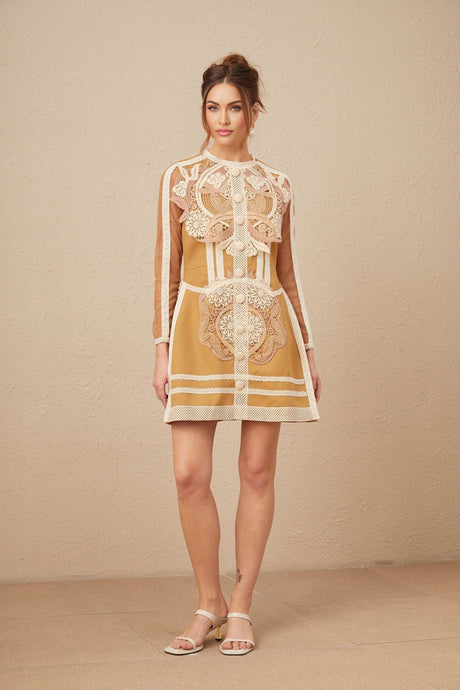 A short white lace dress with a peplum waist and cutout details featuring a fitted bodice and flared skirt